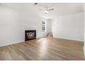 Bright living room boasts hardwood floors and a cozy fireplace, perfect for relaxing at 594 Waynes Se Ct, Atlanta, GA 30354