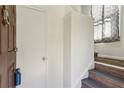 Hallway displaying the stairway to the next level, featuring neutral paint, and wood steps at 2701 Cumberland Se Ct, Smyrna, GA 30080