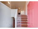 Entryway with hardwood stairs leading to a bright living area with a fireplace at 3110 Chandon Ln, Lawrenceville, GA 30044