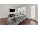 Bright living room with hardwood floors, modern furniture, and natural light at 355 Walker Avenue, Roswell, GA 30076