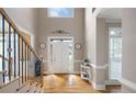 Light-filled foyer with high ceilings, hardwood floors, and an elegant entryway at 416 Telfair Way, Canton, GA 30115