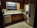 Functional kitchen features a stainless steel refrigerator and ample cabinet space at 5535 Beaver Sw Dr, Mableton, GA 30126