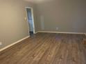 Spacious living room with hardwood flooring and a neutral paint palette at 5690 Deerfield Ct, College Park, GA 30349
