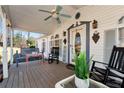 Inviting front porch with rocking chairs, swing, and decorative elements at 1370 Cronic Town Rd, Auburn, GA 30011