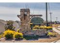 Stone community sign at Hinton Farms entrance with landscaping and a wooden fence at 332 Hinton Farm Way, Dacula, GA 30019