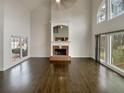 Spacious living room featuring a fireplace and large windows at 4190 Haynes Mill Nw Ct, Kennesaw, GA 30144