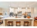 Bright kitchen with white cabinetry, a spacious island, pendant lighting, and stainless steel appliances at 429 Stagecoach Bnd, Smyrna, GA 30080