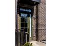 Close up of the home's front door with brick, black trim and an address plaque at 726 Edgewood Ne Ave, Atlanta, GA 30307