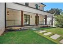 Charming front porch with stone pavers, wooden support columns and contemporary railings at 819 Loridans Ne Dr, Atlanta, GA 30342