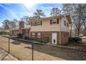 This charming home features brick and siding accents and a fenced in back yard at 7121 Forest Se Dr, Covington, GA 30014