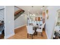Cozy dining room featuring a round table, staircase, and adjacent breakfast bar area at 1253 Caroline Ne St, Atlanta, GA 30307