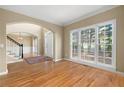 Bright living room featuring large windows and hardwood floors at 514 Lovinggood Ct, Woodstock, GA 30189