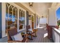 Cozy front porch featuring rocking chairs and classic design elements offer a relaxing outdoor space at 2629 Apple Valley Ne Rd, Brookhaven, GA 30319