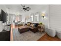 Bright living room featuring wood floors, stylish furniture, and open floor plan at 4740 Cypress Commons, Atlanta, GA 30338