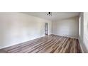 Bright living room featuring wood-look floors and modern lighting at 961 Kingston Nw Rd, Conyers, GA 30012