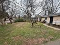 A single-Gathering home with a spacious front yard, sidewalk, and a view of the entrance at 1819 Waldrep Se Cir, Marietta, GA 30060