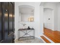 Inviting foyer with hardwood floors, archways, and a decorative table, creating a warm and welcoming entrance at 5816 Riverstone Cir # 11, Atlanta, GA 30339
