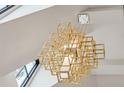 Striking geometric chandelier adding a modern touch to the home's interior with large, open design at 100 Tuxedo Nw Ter, Atlanta, GA 30342