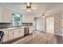 Spacious kitchen featuring quartz counters, stainless steel appliances, and hardwood floors at 1634 Rex Dr, Marietta, GA 30066