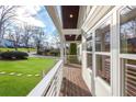 Covered front porch features stylish railing and ample natural light at 1764 Pennington Se Pl, Atlanta, GA 30316