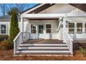 Inviting front porch with stylish railing and painted door, perfect for relaxing at 1764 Pennington Se Pl, Atlanta, GA 30316