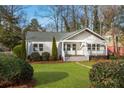 Well-maintained home exterior with lush lawn and inviting front porch at 1764 Pennington Se Pl, Atlanta, GA 30316