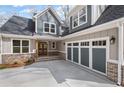 Close up view of the 3-car garage and entrance of this new construction home at 331 Terrell Sw Dr, Marietta, GA 30064