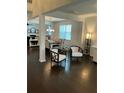 View of the living room featuring hardwood floors, neutral walls, modern furnishings, and an open floor plan at 140 Craines Vw, Covington, GA 30014