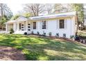 A beautiful view of the home's well-manicured lawn, complemented by mature landscaping at 2466 Sharondale Ne Dr, Atlanta, GA 30305