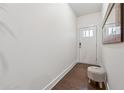 Bright entryway featuring hardwood floors and a white textured stool at 43 N Auburn Landing Pl, Auburn, GA 30011