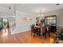 Spacious dining area features hardwood floors, crown molding and a decorative chandelier at 2773 Saddle Horn Place Southwest Pl, Snellville, GA 30039