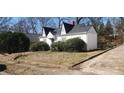 Charming one-story home with gabled roof and front yard awaiting landscaping touch at 1385 Womack Ave, Atlanta, GA 30344