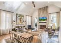 Bright living room with vaulted ceiling, fireplace, and plenty of natural light at 2727 N Thompson Ne Rd, Brookhaven, GA 30319