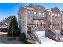 Attractive townhome with brick facade, front stairs, and attached garage at 3185 Quinn Pl, Atlanta, GA 30341