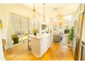 Open kitchen with an island, modern appliances, and seamless flow to the living area at 155 Mado Ln, Palmetto, GA 30268