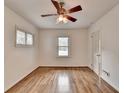 Bright bedroom with hardwood floors, a ceiling fan, and a window at 1830 Jan Hill Ne Ln, Atlanta, GA 30329