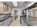Modern kitchen featuring granite countertops, stainless steel appliances, and ample cabinet space at 1830 Jan Hill Ne Ln, Atlanta, GA 30329
