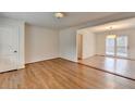 Open-concept living room with hardwood floors and access to the back deck at 1830 Jan Hill Ne Ln, Atlanta, GA 30329
