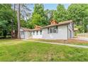 Exterior of charming renovated home with lush green lawn at 313 Linda Dr, Tucker, GA 30084