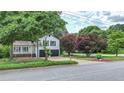 A well-maintained home nestled among lush greenery, complemented by a neatly kept lawn at 101 Summer Pond Trl, Lawrenceville, GA 30046
