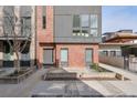Modern brick townhome with concrete entryway, showcasing the home's facade at 1226 Chelsea Nw Cir, Atlanta, GA 30318