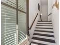 Inviting foyer with wood-trimmed door, staircase, and neutral walls, creating a bright and welcoming space at 2353 Medlock Ln, Decatur, GA 30033