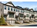 Attractive row of townhomes showcasing modern architectural details and well-maintained landscaping at 2353 Medlock Ln, Decatur, GA 30033