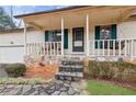 Inviting front porch with stone accents and space for seating at 5176 Downs Way, Norcross, GA 30093