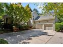 Lovely home exterior with a two-car garage, attractive landscaping, and a spacious driveway for parking at 857 Stovall Ne Pl, Atlanta, GA 30342