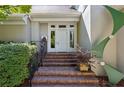 Close-up view of a home's front entrance, showcasing brick steps, iron railings and a stylish door at 857 Stovall Ne Pl, Atlanta, GA 30342