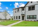 Beautiful new townhome with white brick and siding, dark trim, manicured lawn, and private residence sign at 1330 Parc Bench Rd, Atlanta, GA 30316