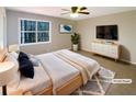 Bright bedroom with a large window and comfortable furnishings at 25 Cloud Forest Ct, Stockbridge, GA 30281