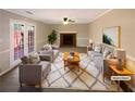 Inviting living room with a cozy fireplace, French doors, and neutral decor at 25 Cloud Forest Ct, Stockbridge, GA 30281