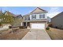 Charming two-story home with a well-manicured front yard and attached two car garage in a quiet neighborhood at 1390 Napa Valley Sw Dr, Lawrenceville, GA 30045